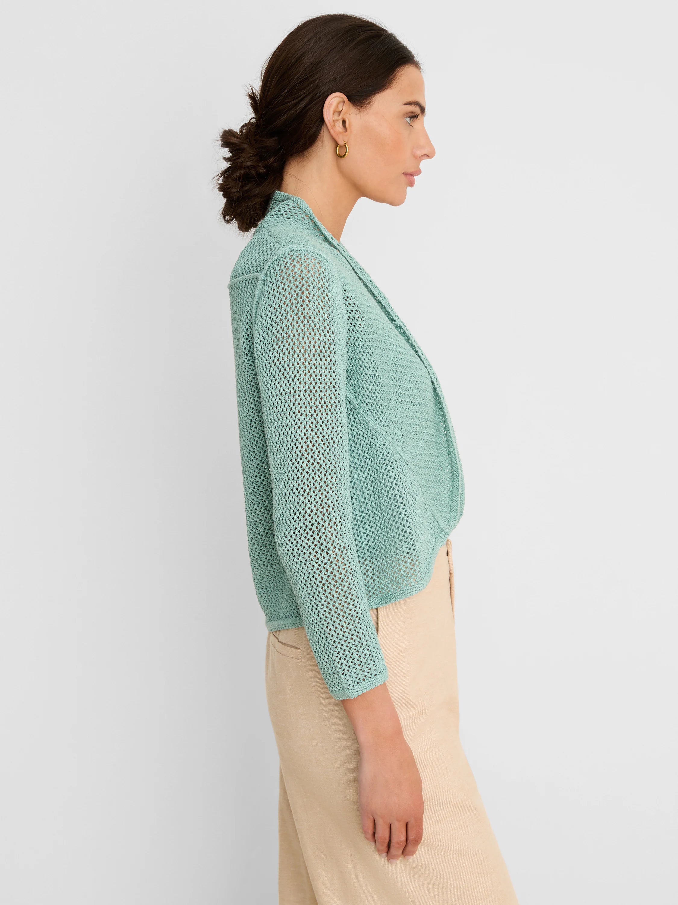 Mint green open-knit mesh cocoon cardigan, draped and cropped.