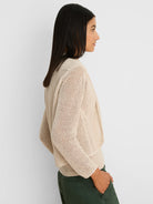 Oatmeal open knit cocoon cardigan, open front, waist length.