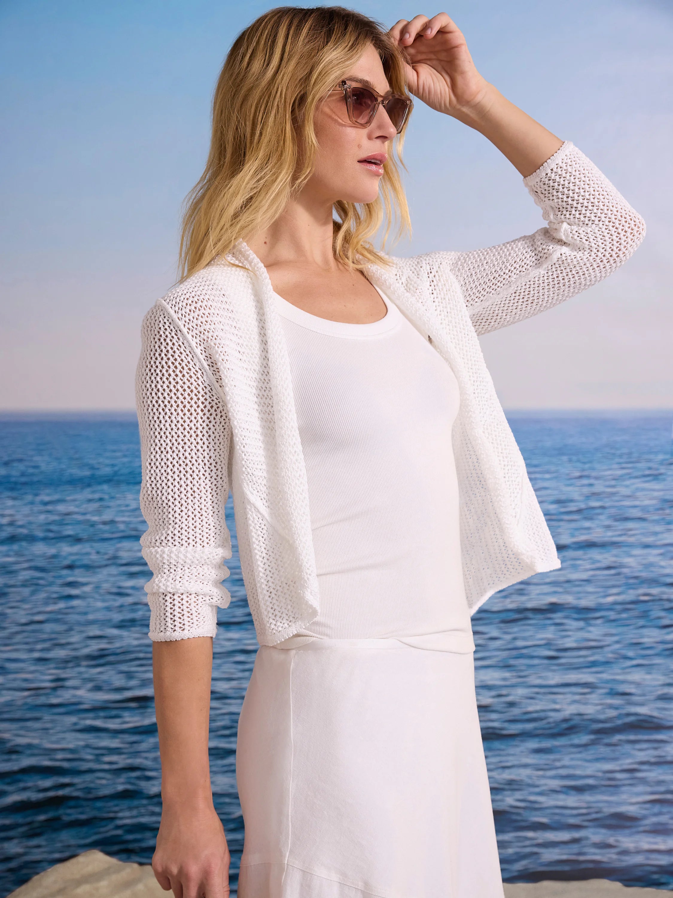 White mesh cocoon cardigan with an open front and long sleeves.