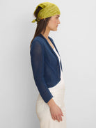 Deep blue open-knit mesh cocoon cardigan, short and open-front style.