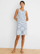 Sleeveless knit dress with white, light blue, and dark blue spacedye pattern, ending at the knee.
