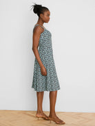 Emma Dress: Mint green, navy, black vine pattern. Sleeveless, thin straps, A-line, knee-length.