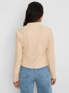 Light beige stretch linen jacket, long sleeves, stand collar, cropped to waist. Back view.