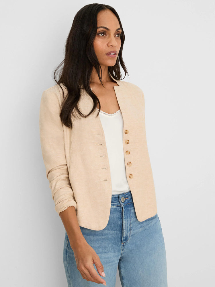 Beige stretch linen jacket, collarless, with a single row of small brown buttons and rolled sleeves.