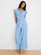 Light blue & white vertical striped gauze shirt with rolled sleeves and matching wide-leg pants.