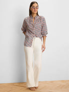 Pink, blue, tan geometric crinkle shirt with ruffled collar and smocked 3/4 sleeves.