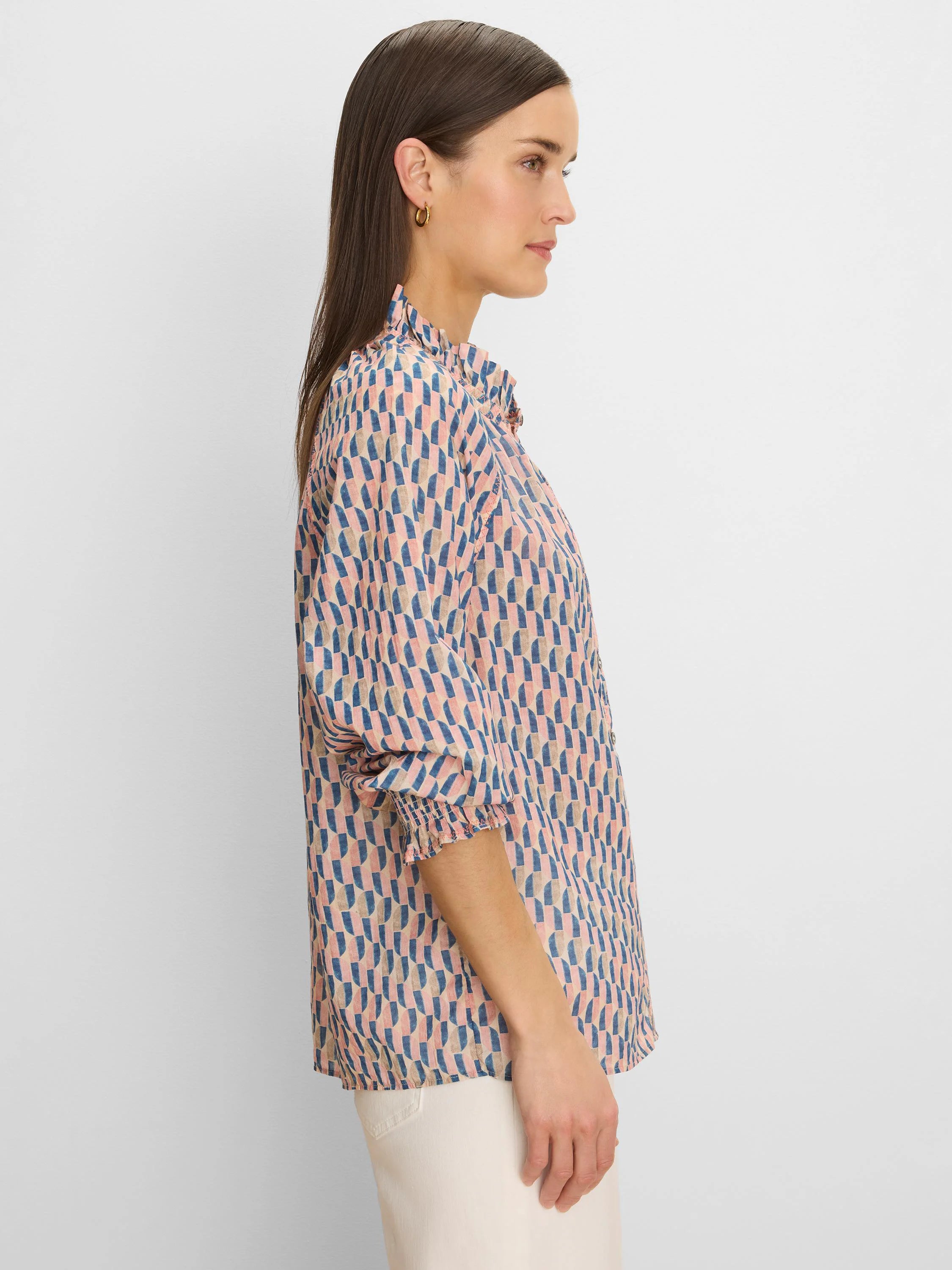 Pink, blue, tan geometric patterned crinkle shirt with a ruffled collar and smocked cuffs.