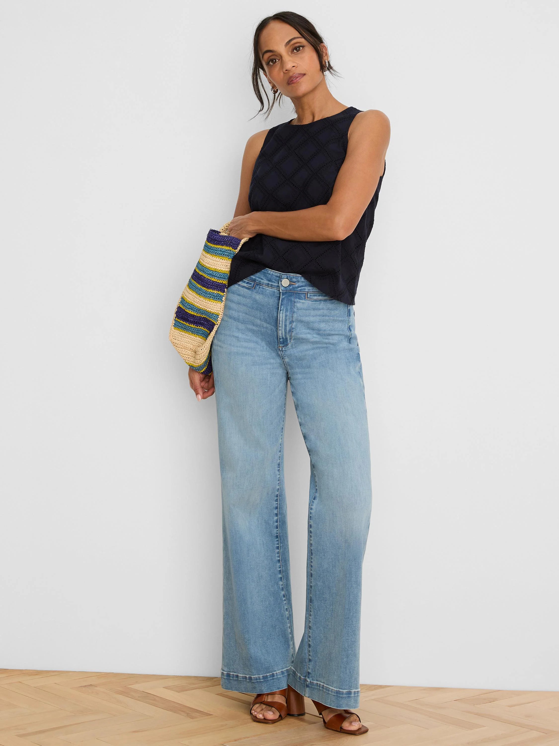 Navy sleeveless top with a diamond eyelet pattern.
