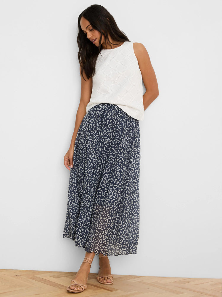 White sleeveless top with an all-over diamond eyelet pattern.