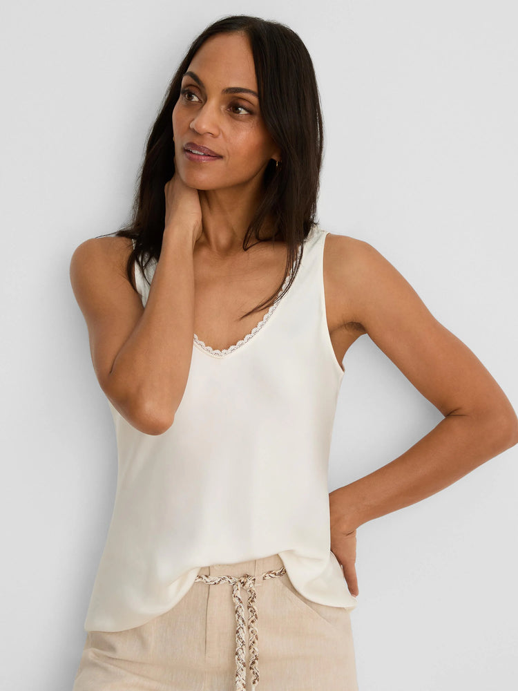 Ivory V-neck tank with a glossy finish & lace trim.