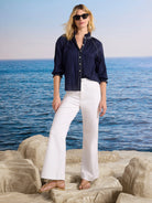 Navy crinkle shirt with white zig-zag stitching on ruffled collar, button placket, and 3/4 sleeves.