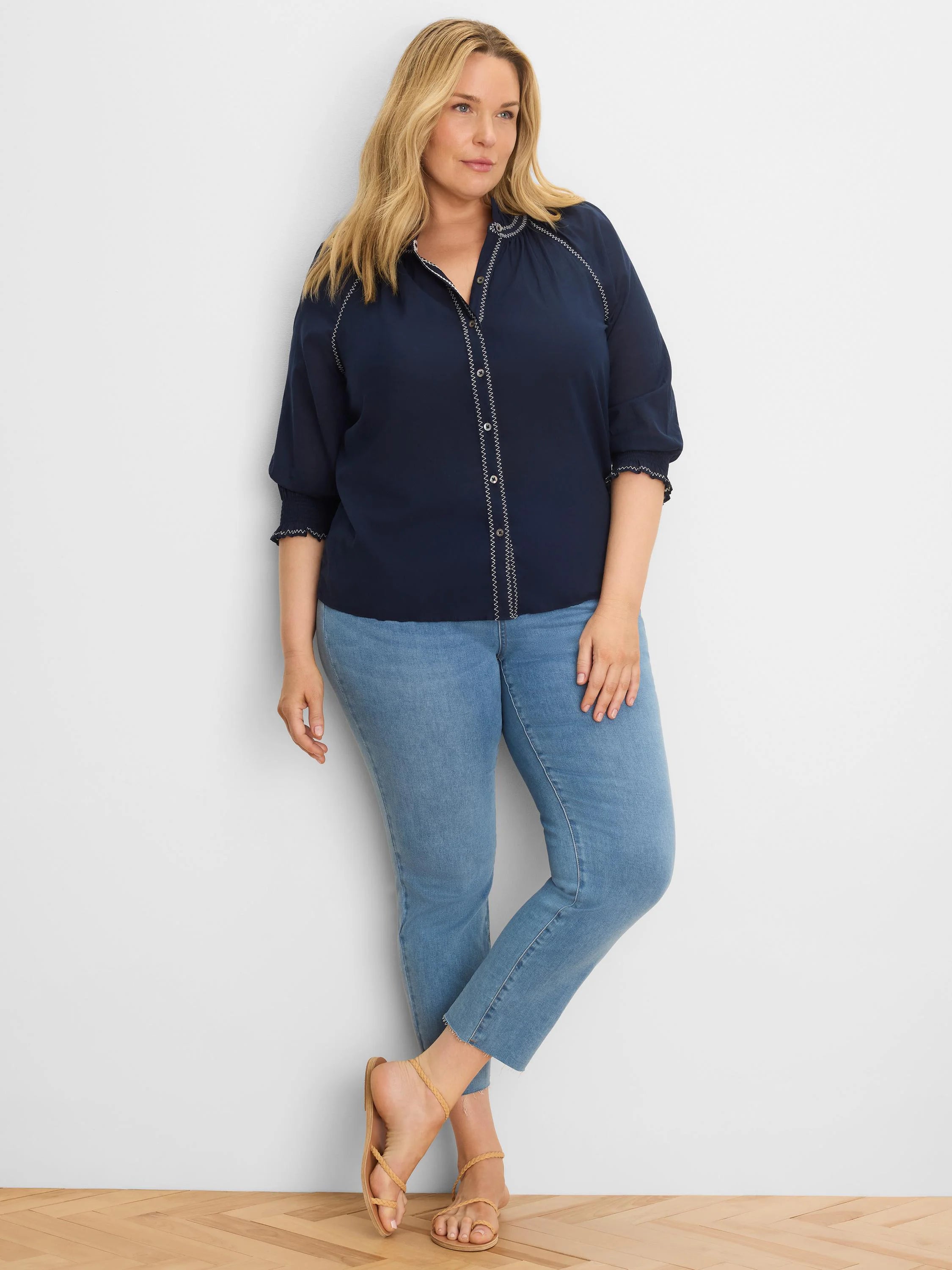 Navy cotton crinkle shirt with white zig-zag stitching on placket, collar, and 3/4 sleeves.