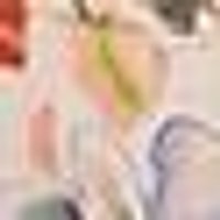 Blurry, soft-focus light beige swatch with faint hints of pale pink and lime green.