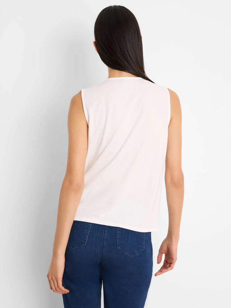 Cream sleeveless top with a round neck, smooth fabric, shown from the back.