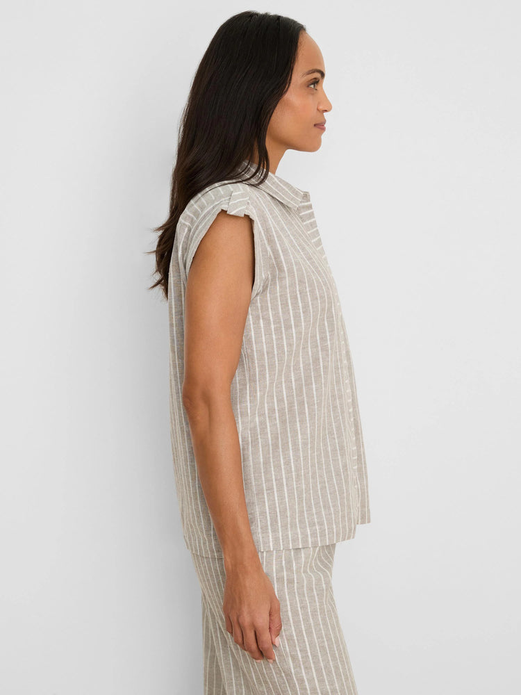 Tan collared sleeveless shirt with shimmering white vertical stripes.
