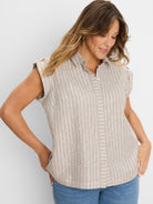 Tan linen resort shirt with white Lurex vertical stripes, short sleeves, and a collared button-front.