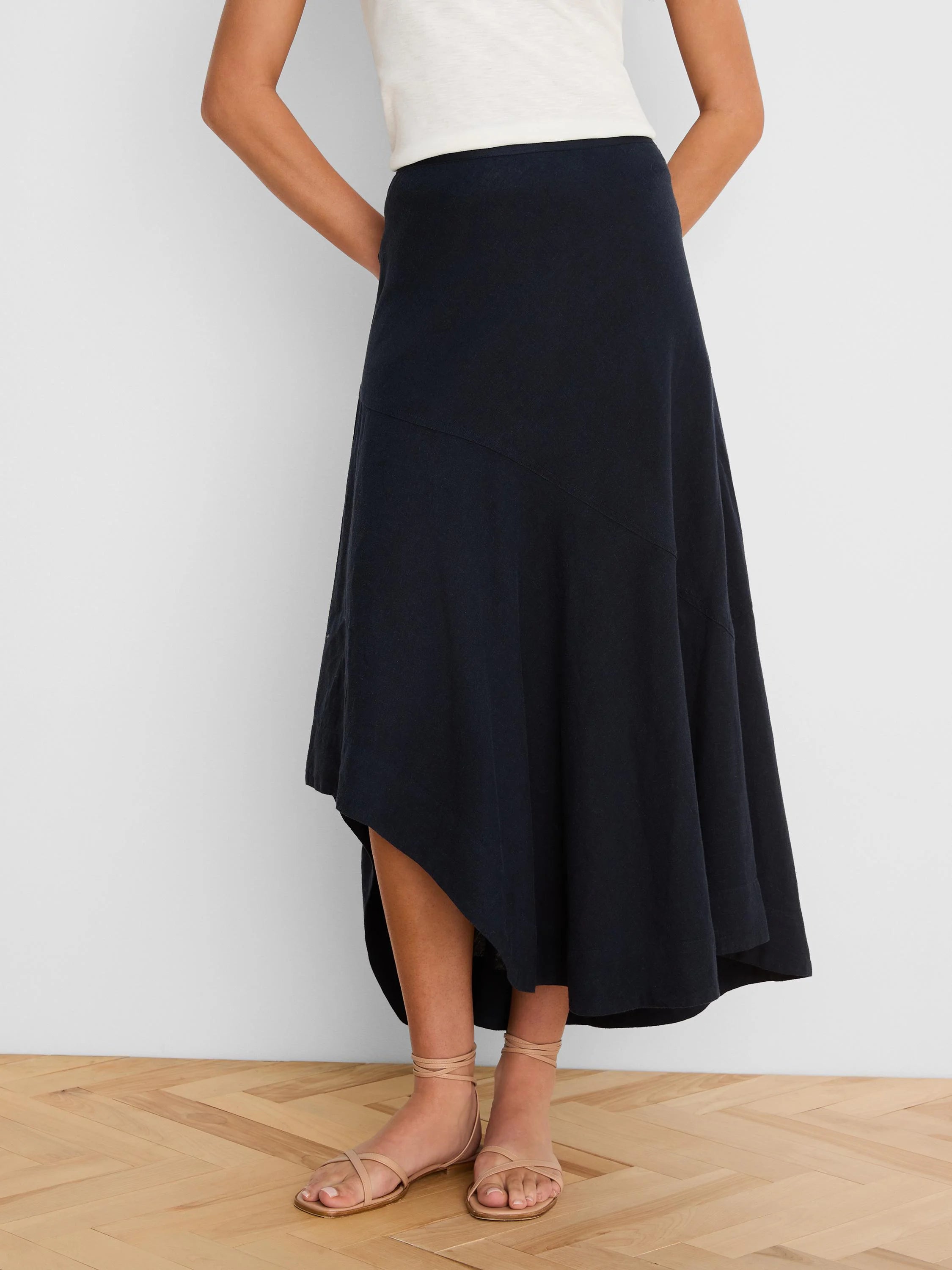 Navy blue linen skirt with a long, flowing asymmetrical "rumba" hem.