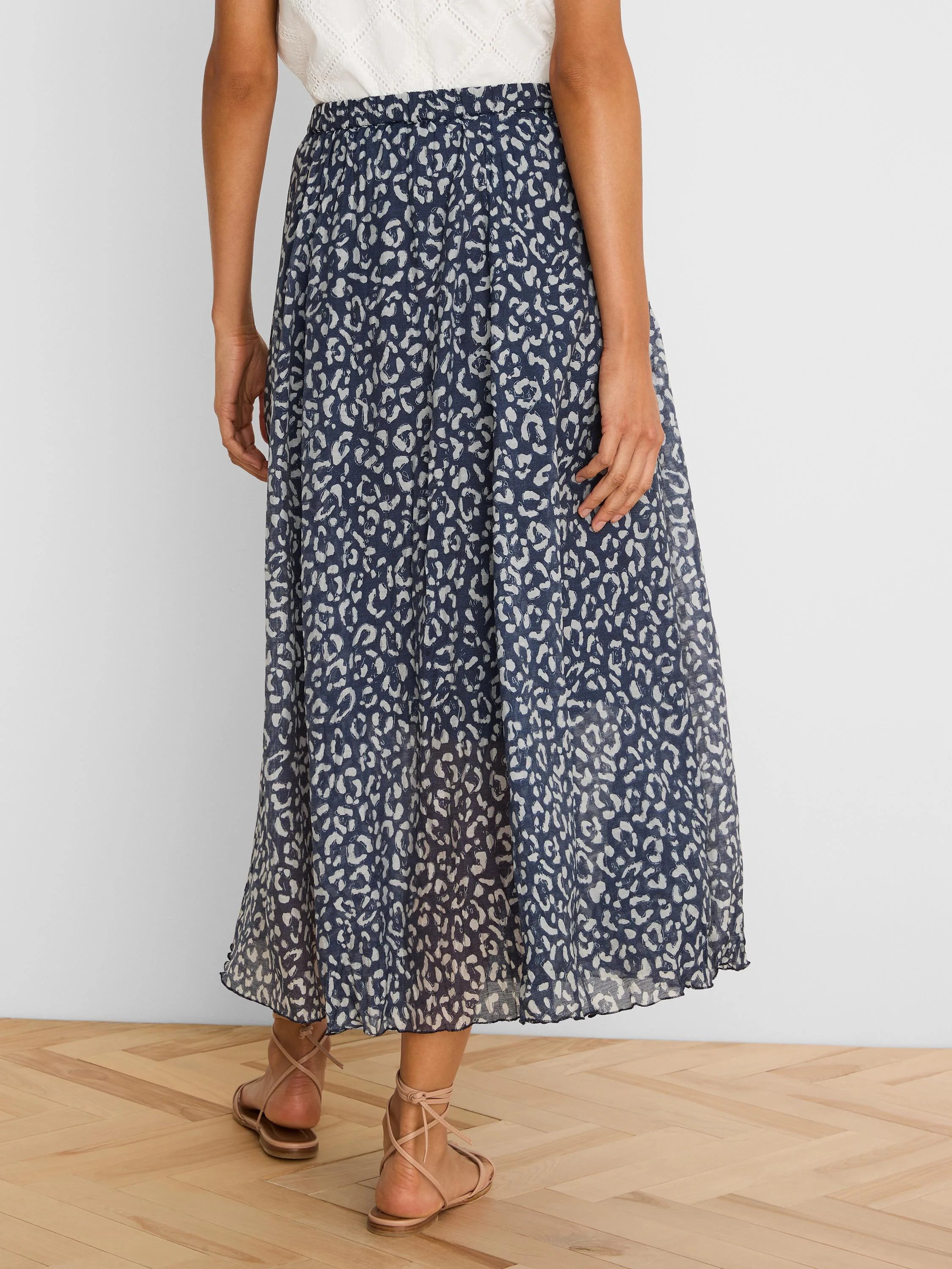 Navy crinkle midi skirt with off-white sketched leopard spots.