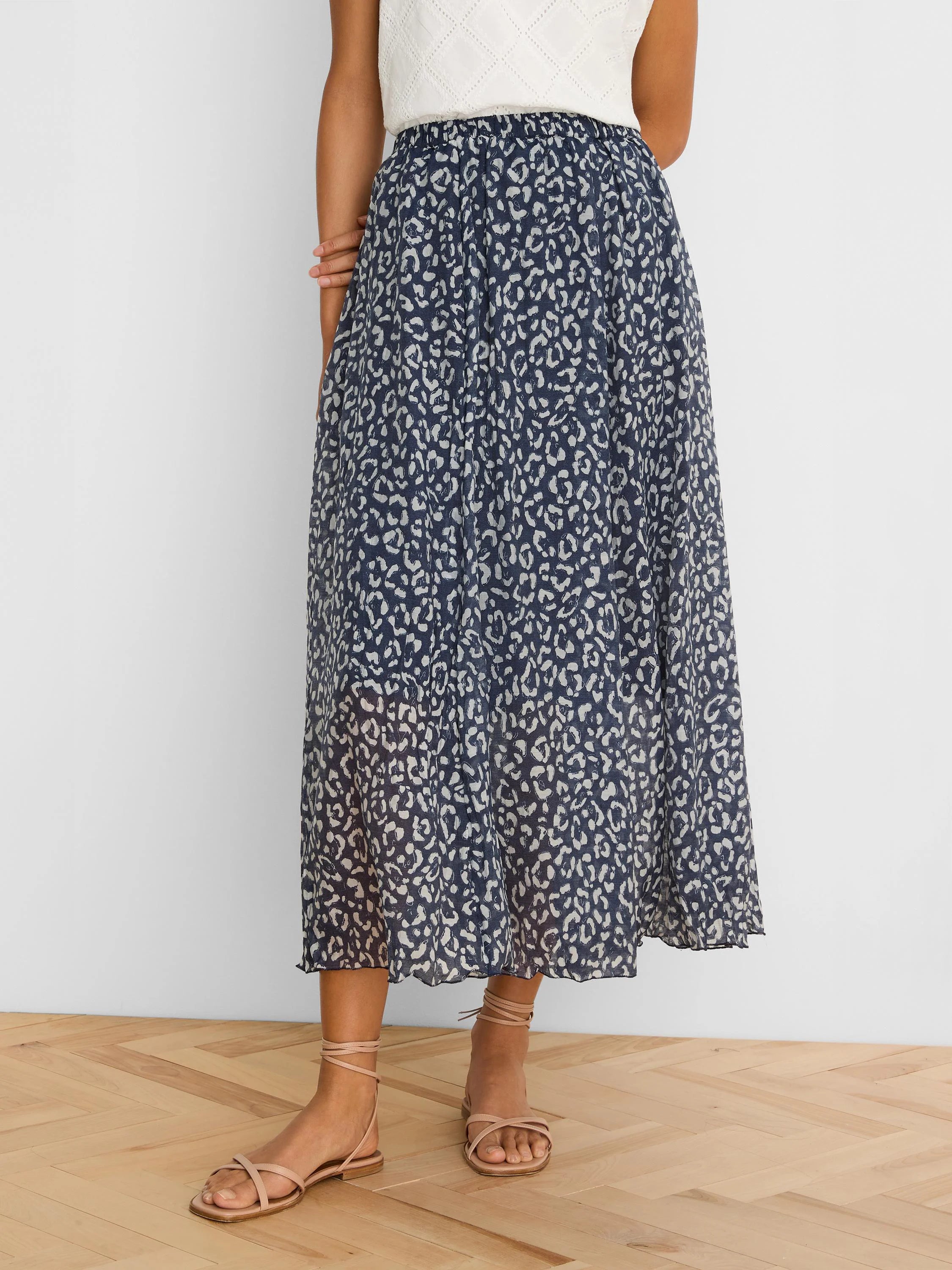 Navy crinkle midi skirt with light leopard sketch pattern, ankle-length.