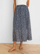 Navy crinkle midi skirt with light leopard sketch pattern, ankle-length.