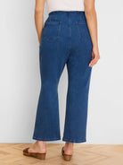 Dark blue boot-cut jeans, high-waisted, with a wide waistband and two back patch pockets, shown from behind.