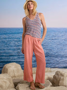 Coral wide-leg drapey cargo ankle pants with an elastic waist and side pockets.