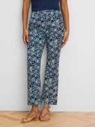Dark blue and white shibori lily ankle pants with a demi-boot cut.
