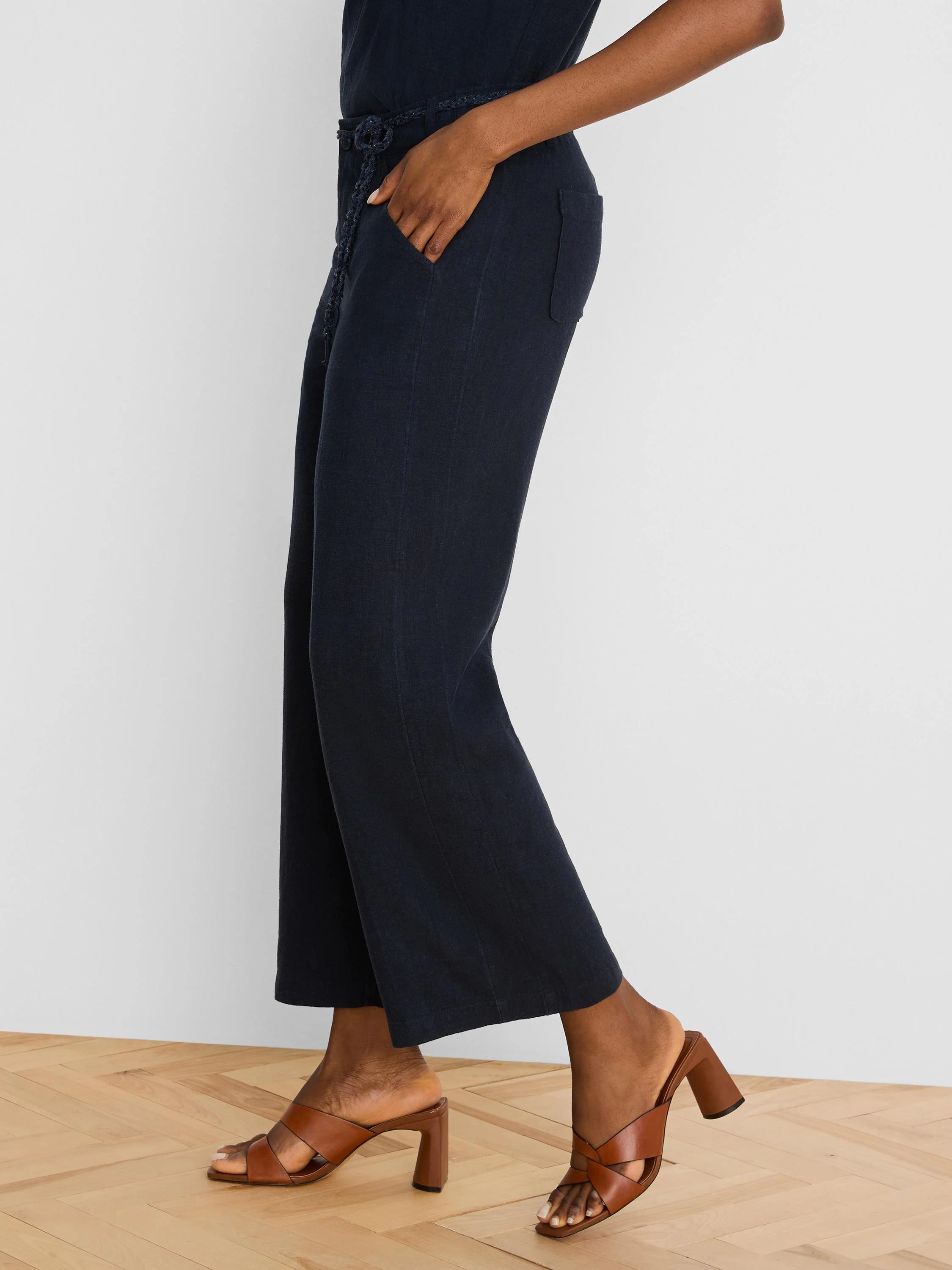 Dark navy wide-leg linen crop pants with braided belt, side and back pockets.