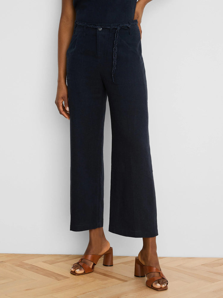 Navy wide-leg cropped linen pants with a braided self-fabric belt.