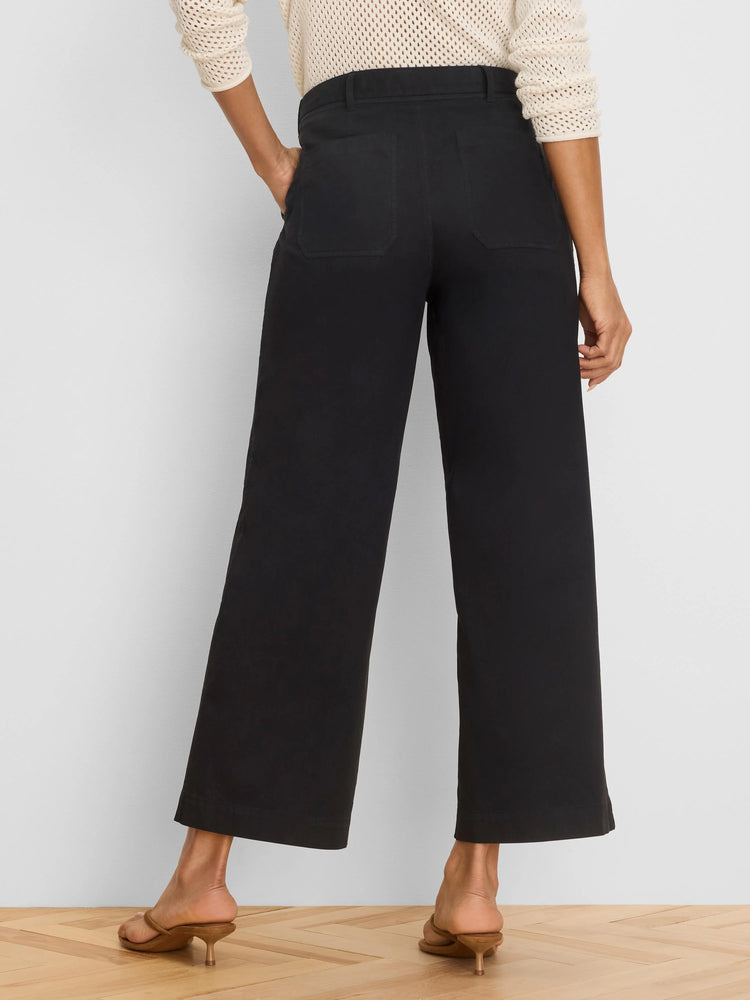 Rear view of black wide-leg ankle pants with visible belt loops and two back patch pockets.