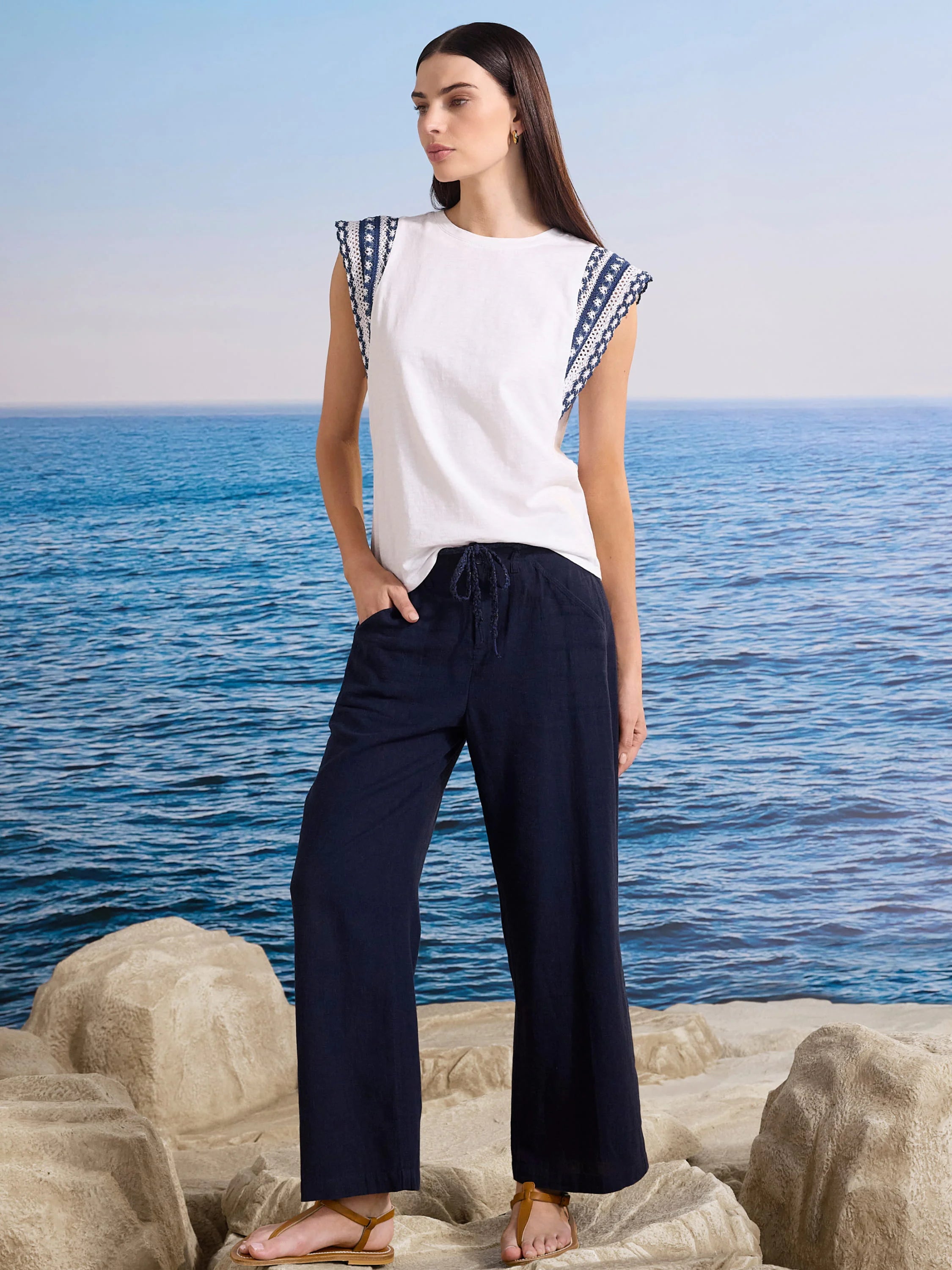 Navy wide leg ankle pants with a drawstring waist.