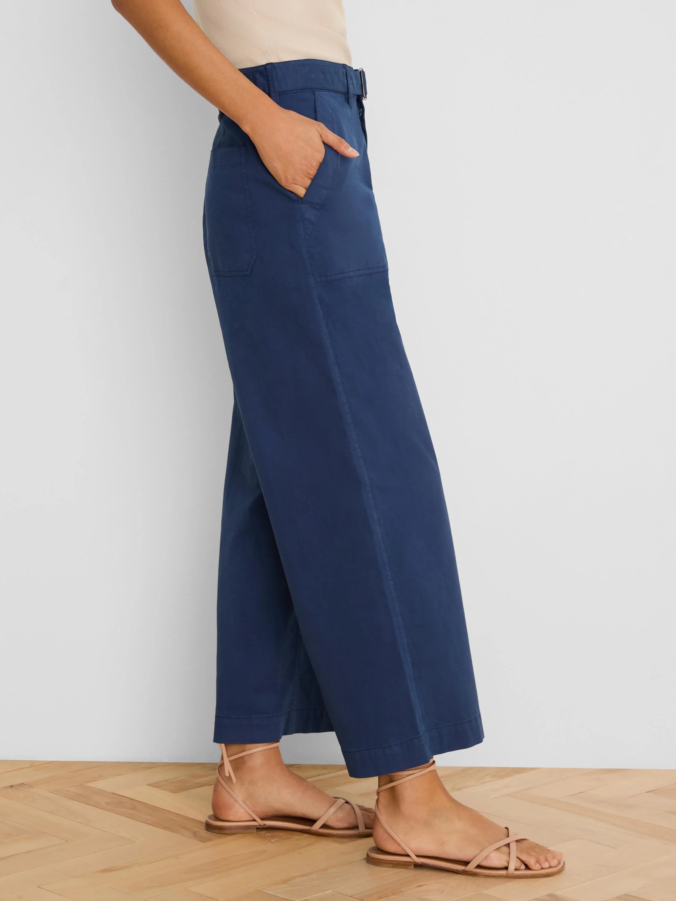 Navy wide-leg belted ankle pants with side pockets.