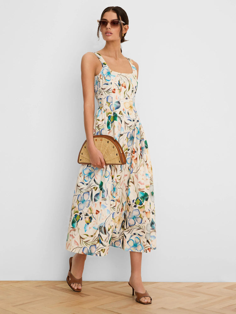 Cream sleeveless midi dress with a multi-colored floral print in blue, green, and muted orange.