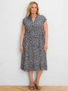 Navy and off-white leopard sketch midi dress with V-neck, short sleeves, button front, and tie waist.