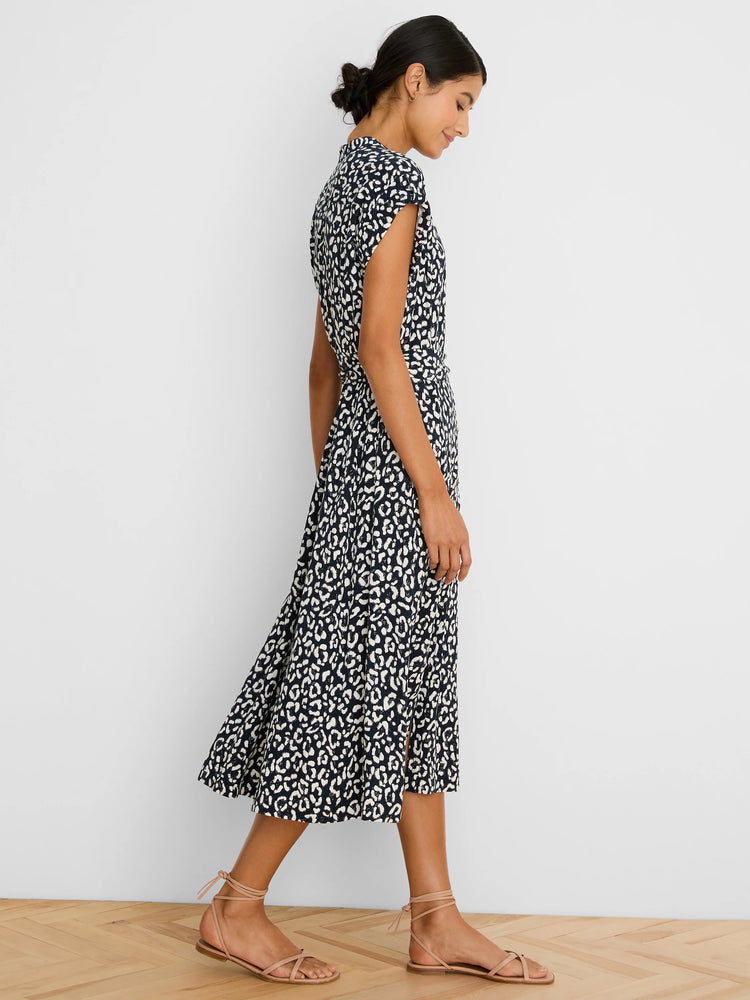 Navy blue midi dress with off-white leopard sketch print, collared and cap-sleeved.
