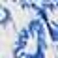 Swirling blues (dark to light) and creamy whites in a blurred, marbled pattern.