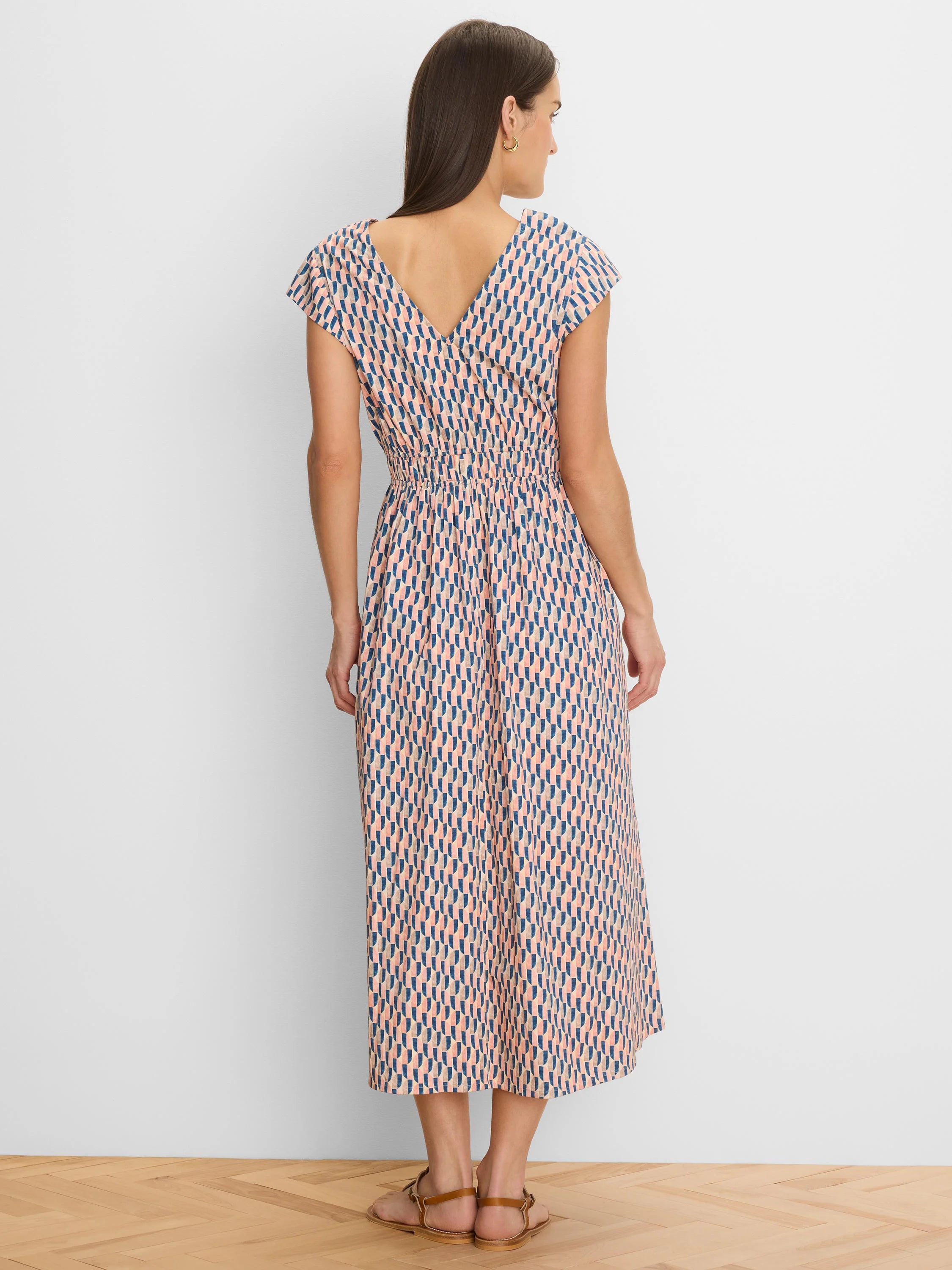 Cap sleeve midi dress with pink, blue, beige geometric pattern, V-back, and elasticated waist.