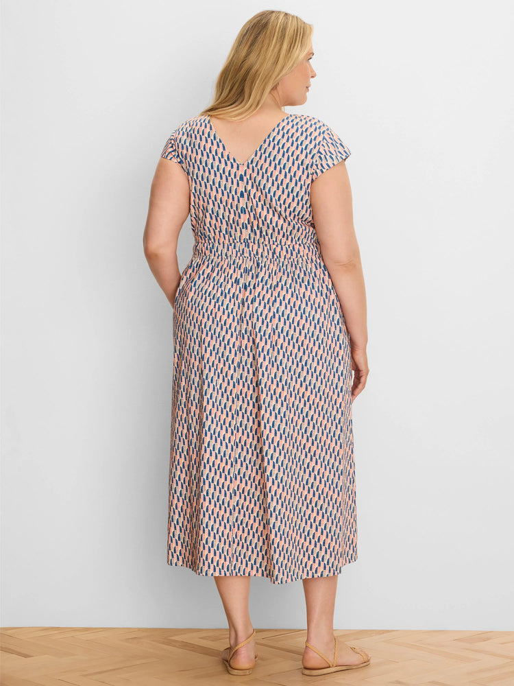 Midi dress with cap sleeves, V-back, and elasticated waist. Features a peach, navy, and tan geometric pattern.