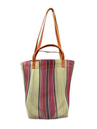 Mini market bag with tan leather straps and vertical stripes of pale yellow, burgundy, and dark brown on a mesh body.