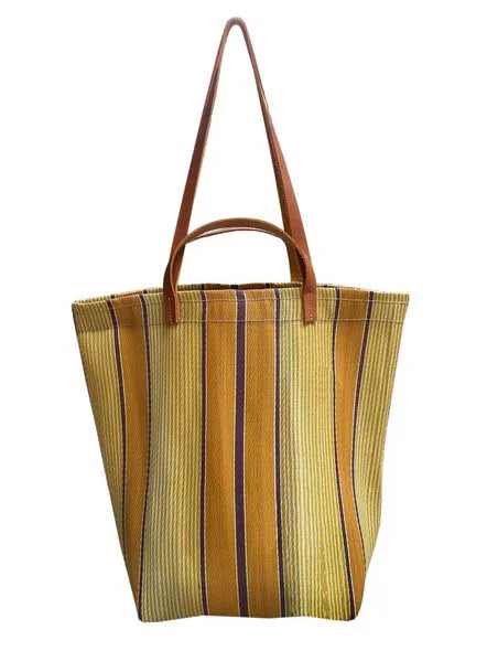 Yellow, gold, and brown striped tote bag with brown leather handles.