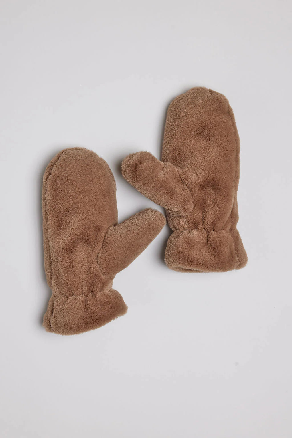 Pair of brown faux fur mittens.  Soft, fluffy texture.  Mittens are shown lying flat.