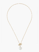 Gold chain necklace with a large, off-white pearl toggle clasp.