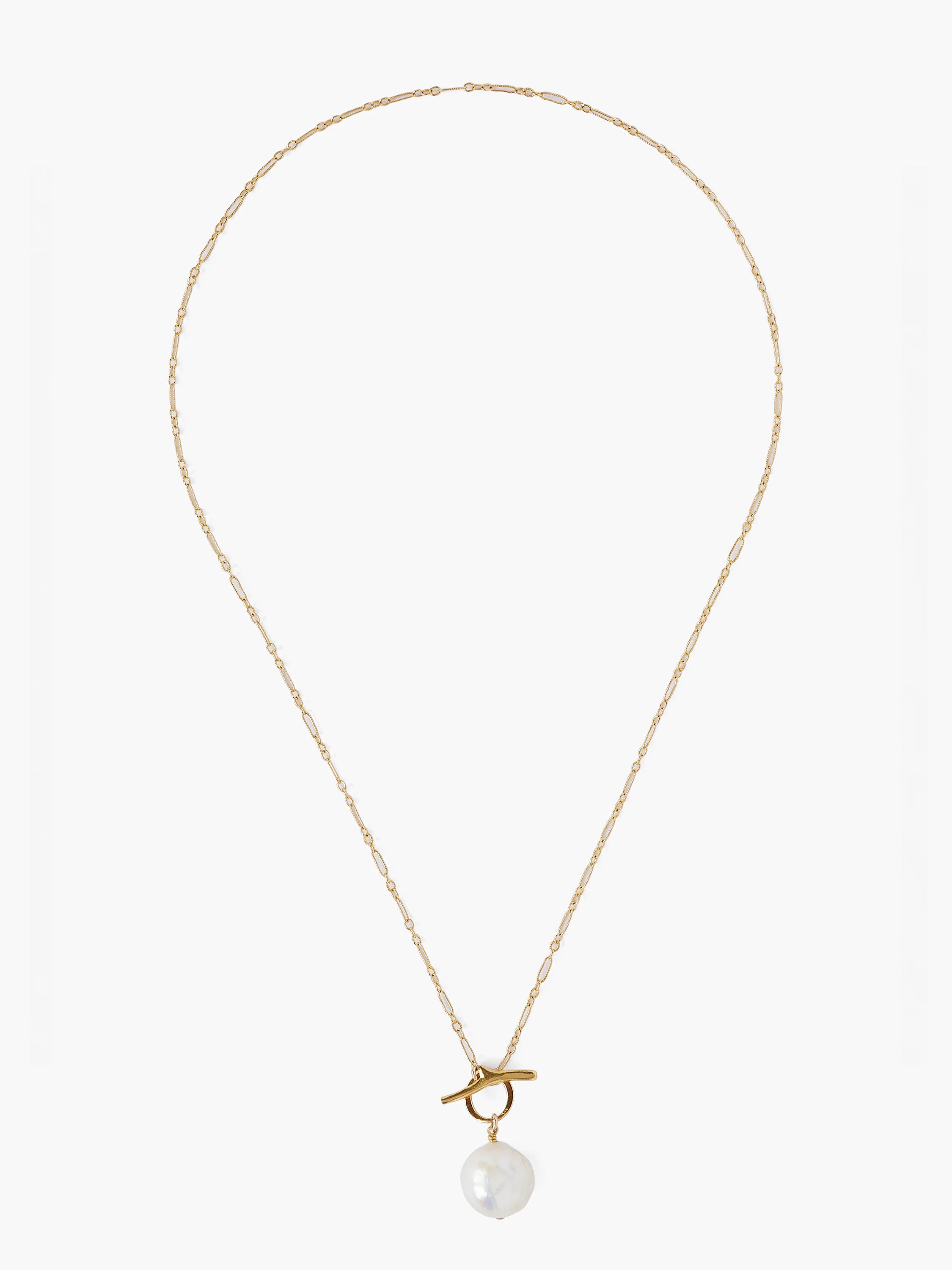 Gold chain necklace with a large, off-white pearl toggle clasp.