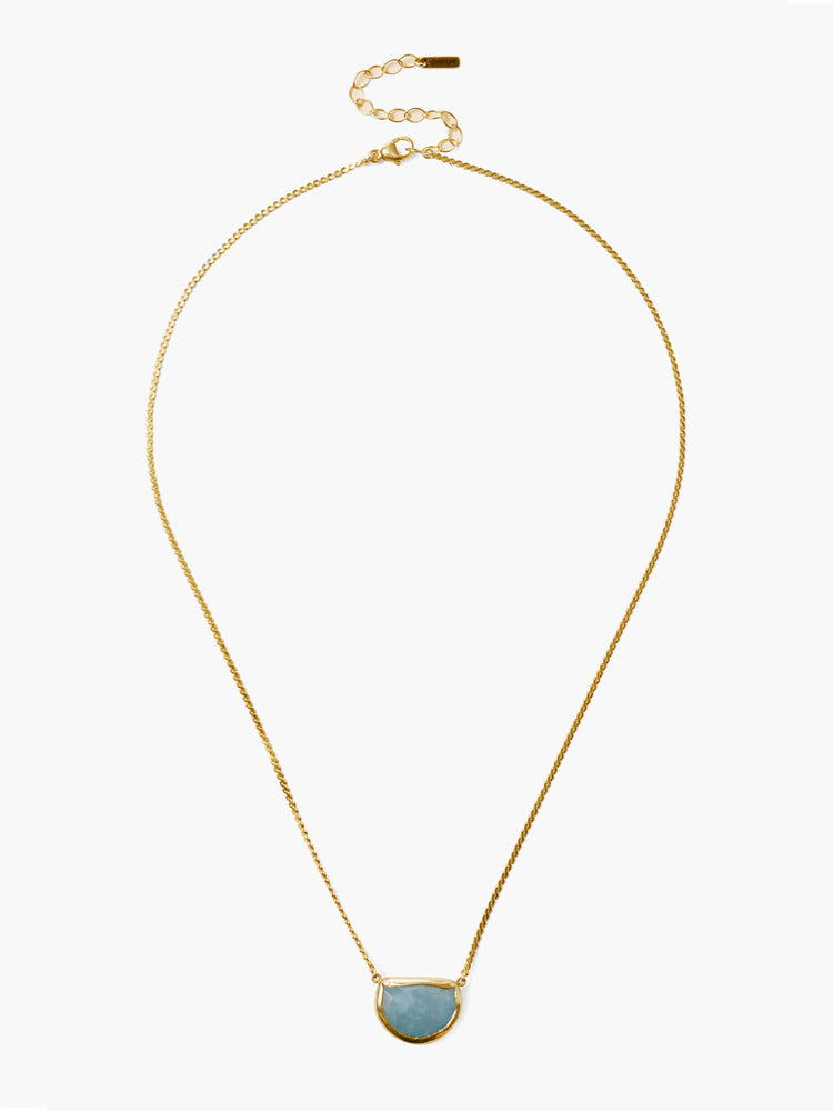 Gold-tone chain necklace with a light blue, semi-circular moonstone pendant in a gold bezel. Features an extender chain.