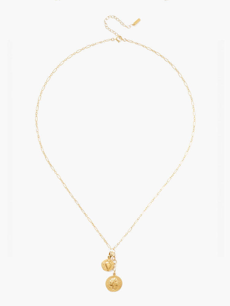 Gold necklace with a delicate chain and two gold charms: a heart and a coin with a profile.