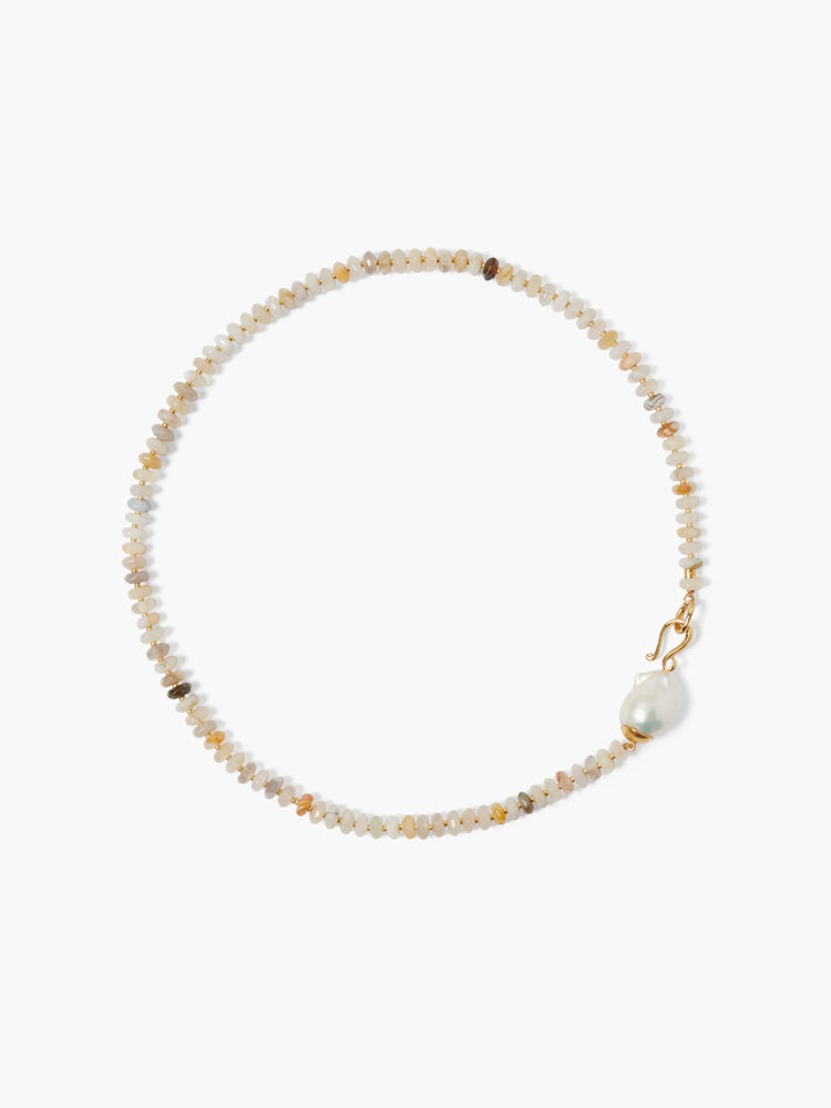 Gold necklace with off-white, tan, and brown opal beads; features a single off-white pearl accent.
