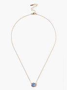 Gold chain necklace with a single, round, light blue stone pendant.