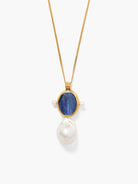 Gold necklace with an oval dark blue kyanite stone flanked by two small pearls, with a large irregular white pearl below.