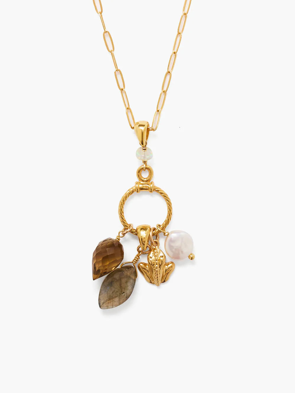 Gold chain necklace, gold ring with brown stone, gray labradorite, gold frog, and white pearl charms.