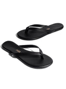 Sleek black leather flat flip-flops featuring thin straps and a minimalist design.